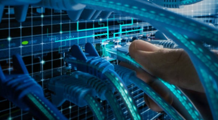 Technician plugging in fiber cables